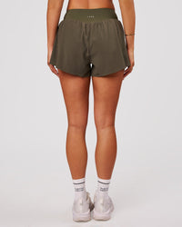 Woman wearing Pacer 3" Run Short - Pure Olive | Model:Bianca | Size:S | Thumbnail Index: 6