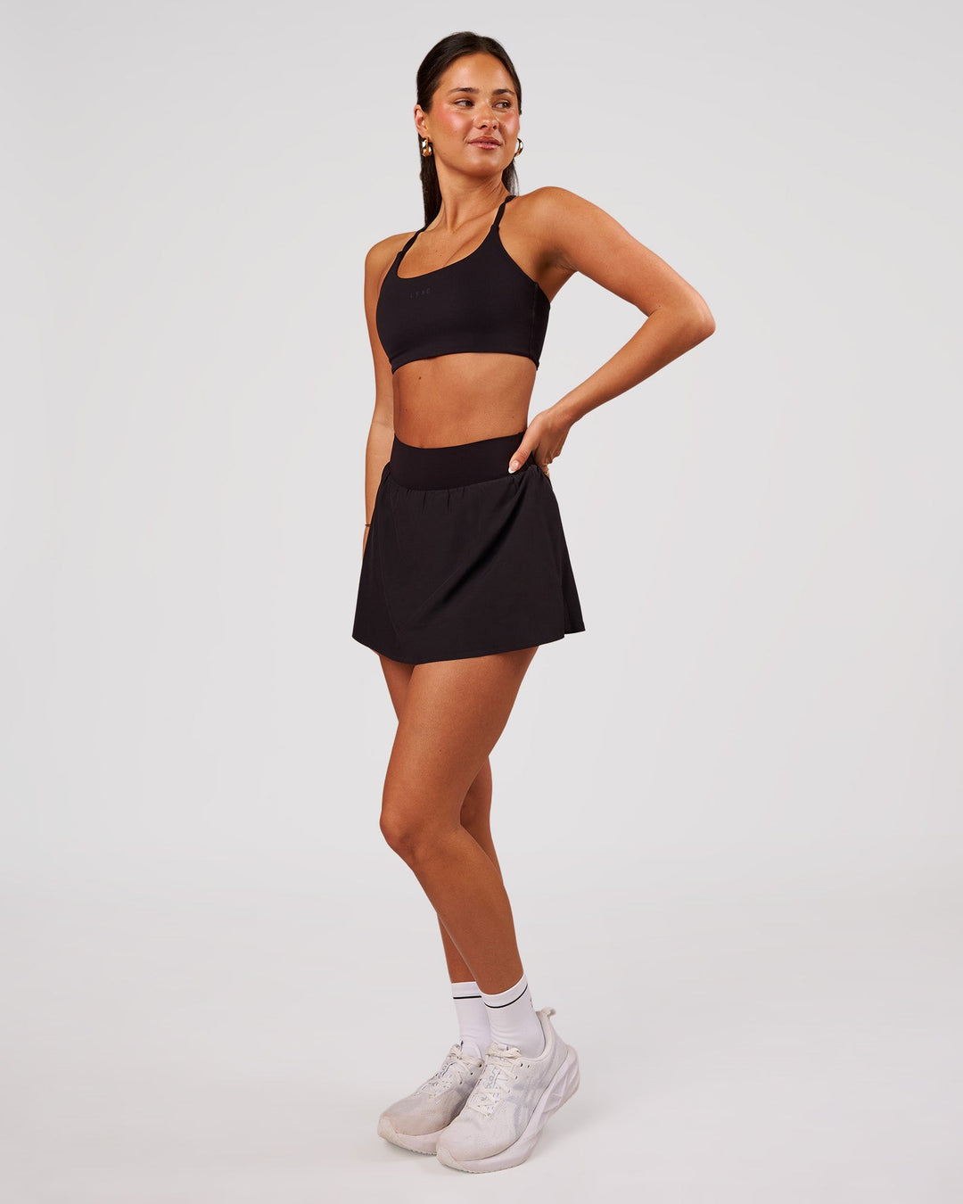 Woman wearing Pacer Skirt - Black | Model:Bianca | Size:S - view 3