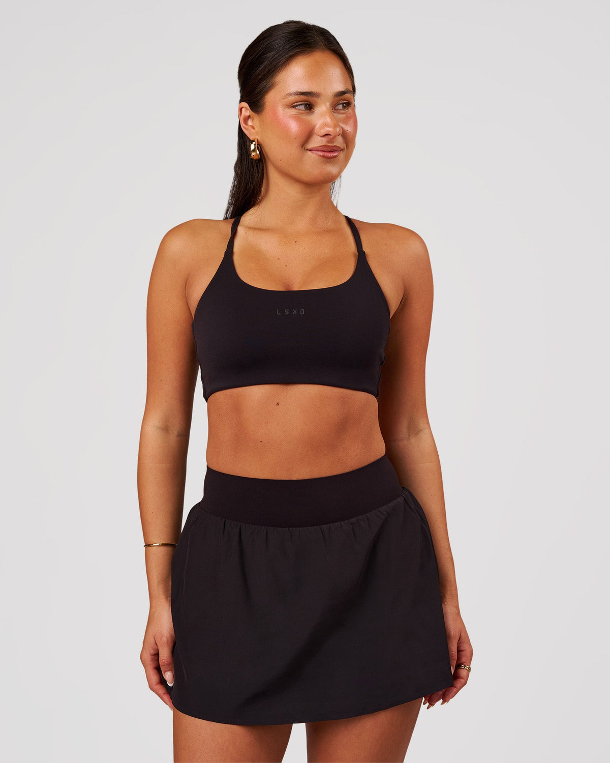 Woman wearing Pacer Skirt - Black | Model:Bianca | Size:S - view 2