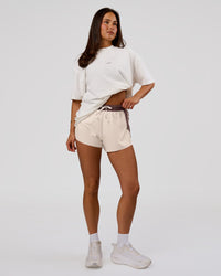 Woman wearing Run Club Unisex Oversized Heavyweight FLXCotton Tee - Off White | Model:Bianca | Size:S | Thumbnail Index: 11