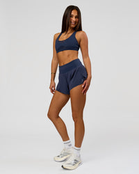 Woman wearing Tia-Clair Toomey-Orr Accelerate 3" Storage Running Short - Future Navy | Model:Bianca | Size:S | Thumbnail Index: 12