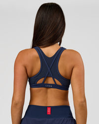 Woman wearing Unstoppable Racerback Sports Bra - Future Navy | Model:Bianca | Size:S | Thumbnail Index: 5