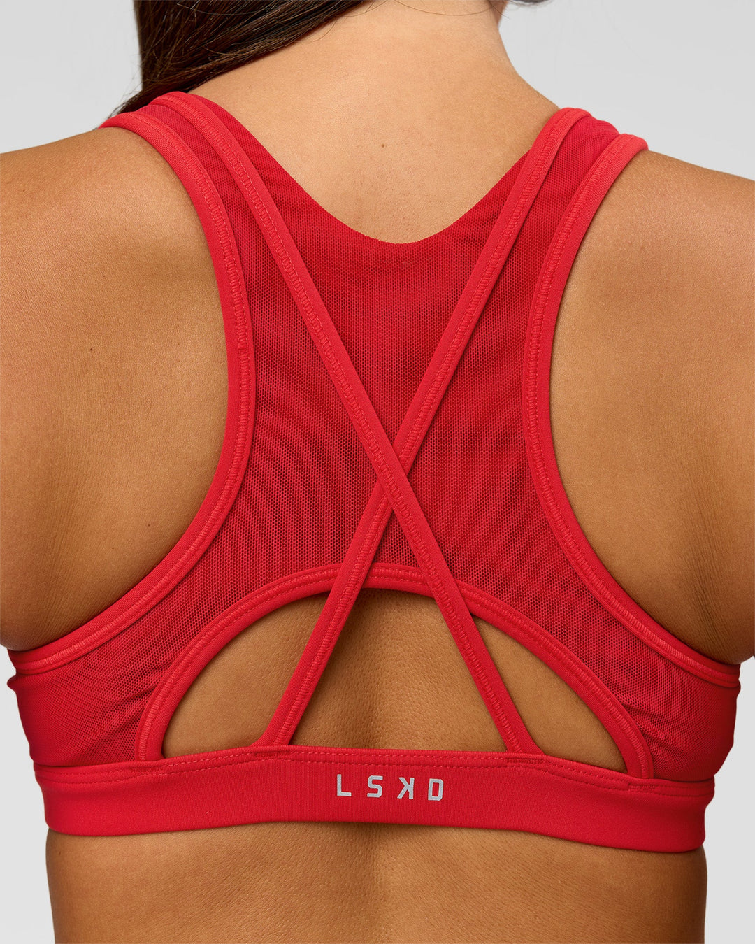 Woman wearing Unstoppable Racerback Sports Bra - Scarlet | Model:Bianca | Size:S - view 2