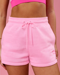 Woman wearing We Rise Shorts  - Pink Rose-We Rise | Model:Bianca | Size:S | Thumbnail Index: 0