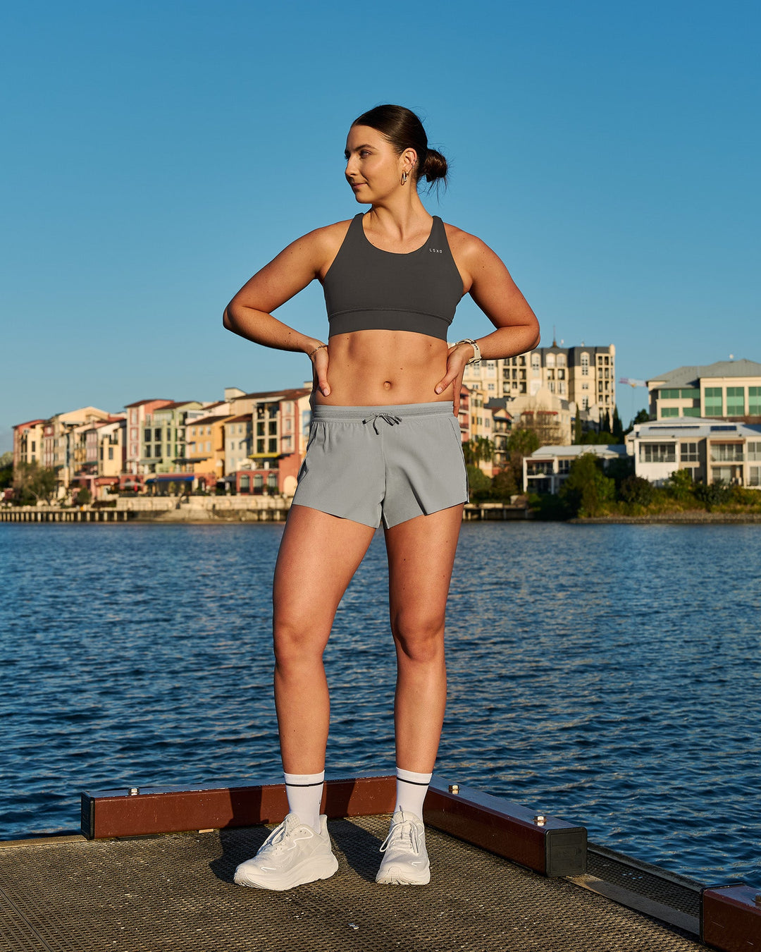 Woman wearing Accelerate Sports Bra - Onyx | Model:Emily | Size:S - view 8