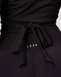 Woman wearing All Day Wrap FLXCotton Long Sleeve Top - Black | Model:Jordan | Size:S | Thumbnail Index: 5