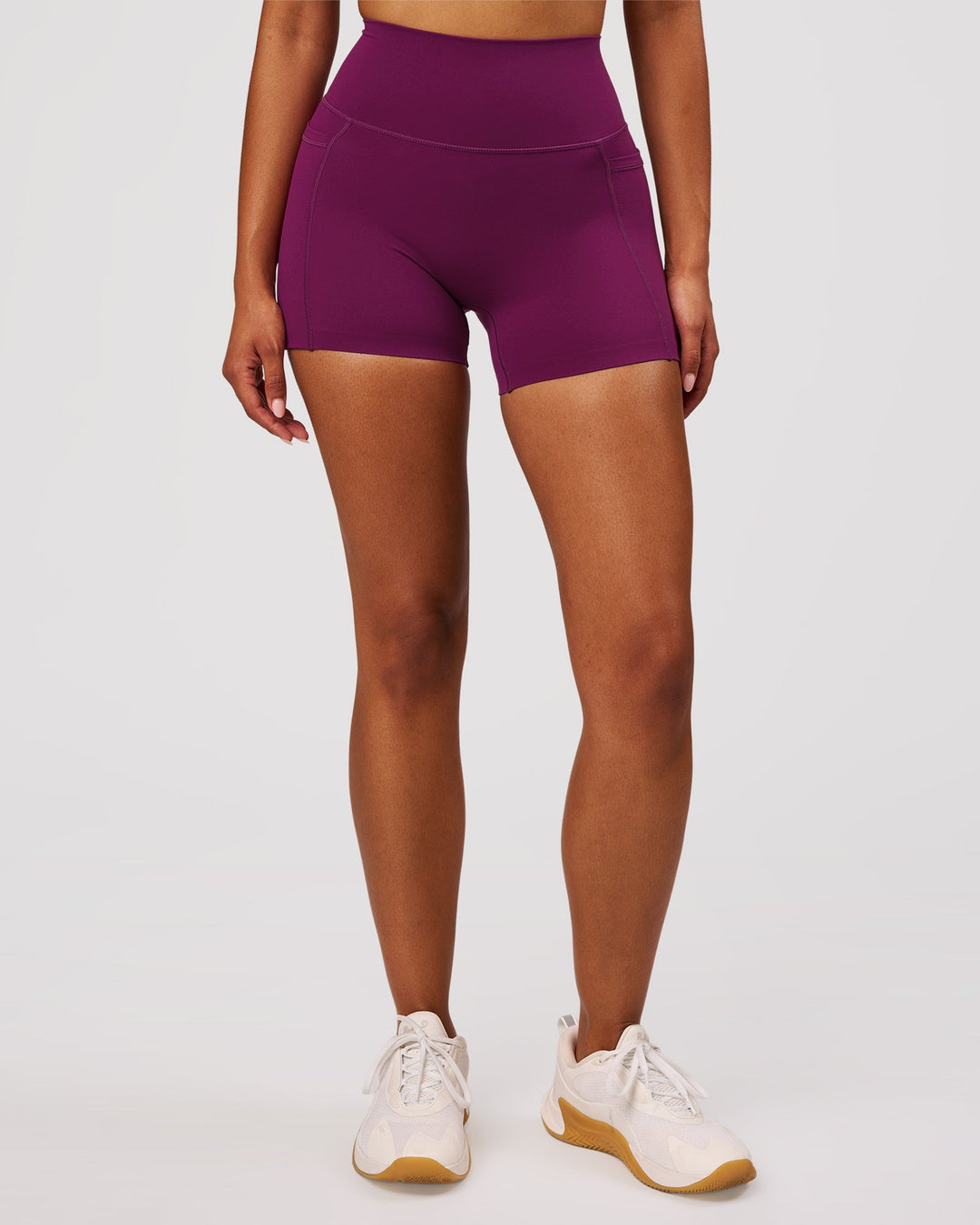 Woman wearing Elixir High-Rise 4" Short Pockets - Plum Caspia | Model:Jordan | Size:S - view 5