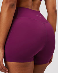Woman wearing Elixir High-Rise 4" Short Pockets - Plum Caspia | Model:Jordan | Size:S | Thumbnail Index: 1