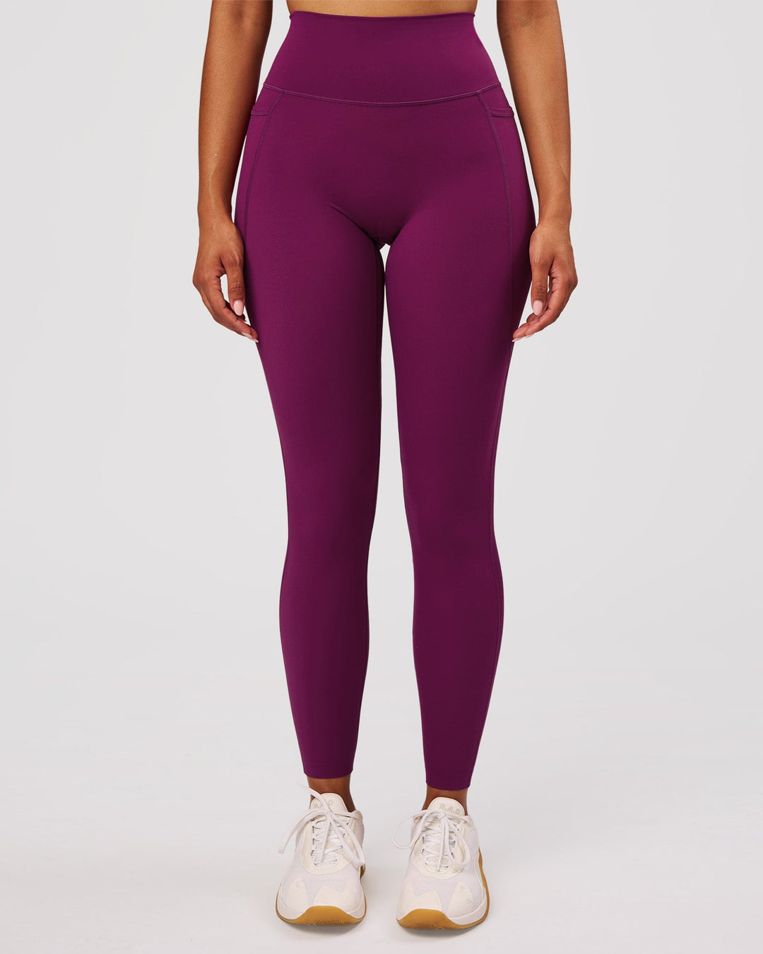 Woman wearing Elixir High-Rise Full Length Legging Pockets - Plum Caspia | Model:Jordan | Size:S - view 1