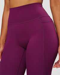 Woman wearing Elixir High-Rise Full Length Legging Pockets - Plum Caspia | Model:Jordan | Size:S | Thumbnail Index: 2