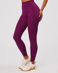 Woman wearing Elixir High-Rise Full Length Legging Pockets - Plum Caspia | Model:Jordan | Size:S | Thumbnail Index: 3
