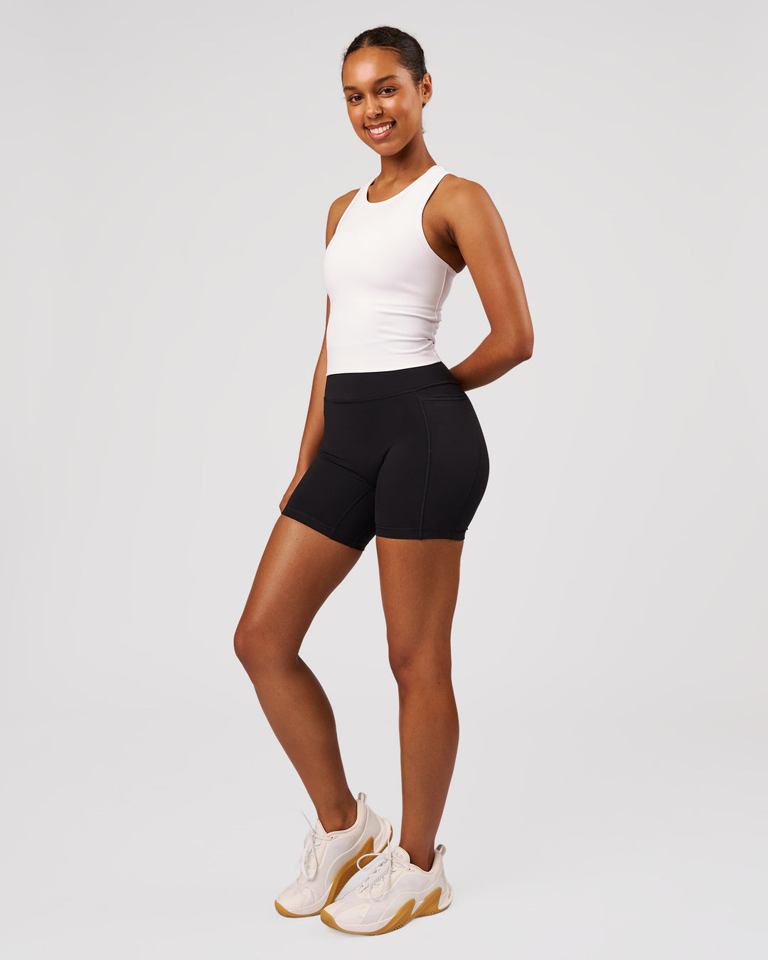 Woman wearing Flow Performance Tank 2.0 - White | Model:Jordan | Size:S - view 4