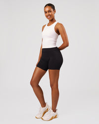 Woman wearing Flow Performance Tank 2.0 - White | Model:Jordan | Size:S | Thumbnail Index: 3