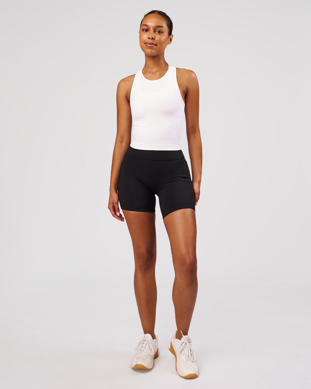 Woman wearing Flow Performance Tank 2.0 - White | Model:Jordan | Size:S - view 6