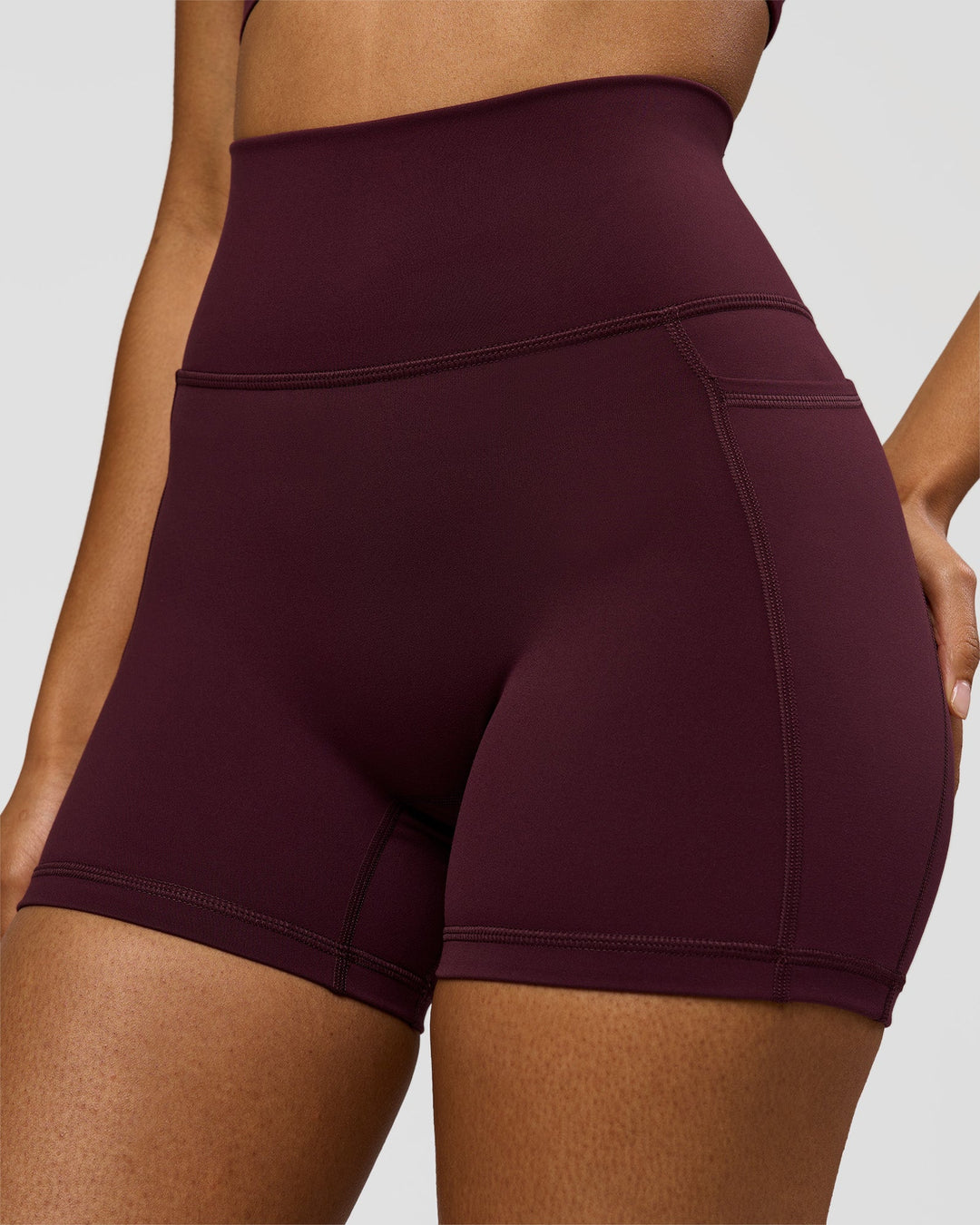 Woman wearing Fusion Ultra High-Rise 4" Short Pockets - Cherry Lacquer | Model:Jordan | Size:S - view 1