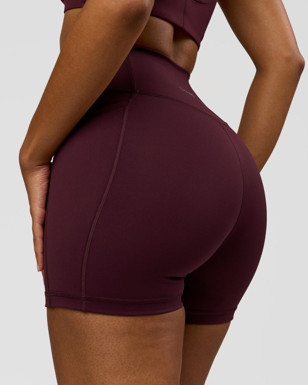 Woman wearing Fusion Ultra High-Rise 4" Short Pockets - Cherry Lacquer | Model:Jordan | Size:S - view 5