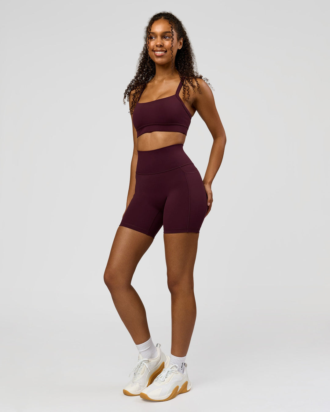 Woman wearing Fusion Ultra High-Rise 6" Short Pockets - Cherry Lacquer | Model:Jordan | Size:S - view 3