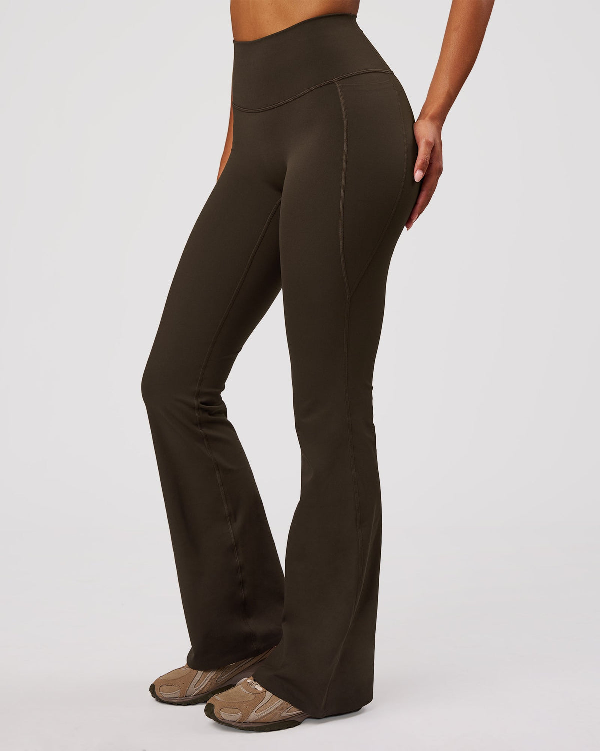 Woman wearing Fusion V-Contour High-Rise Flared Legging Pockets - Ground Coffee | Model:Jordan | Size:S