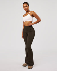 Woman wearing Fusion V-Contour High-Rise Flared Legging Pockets - Ground Coffee | Model:Jordan | Size:S | Thumbnail Index: 7