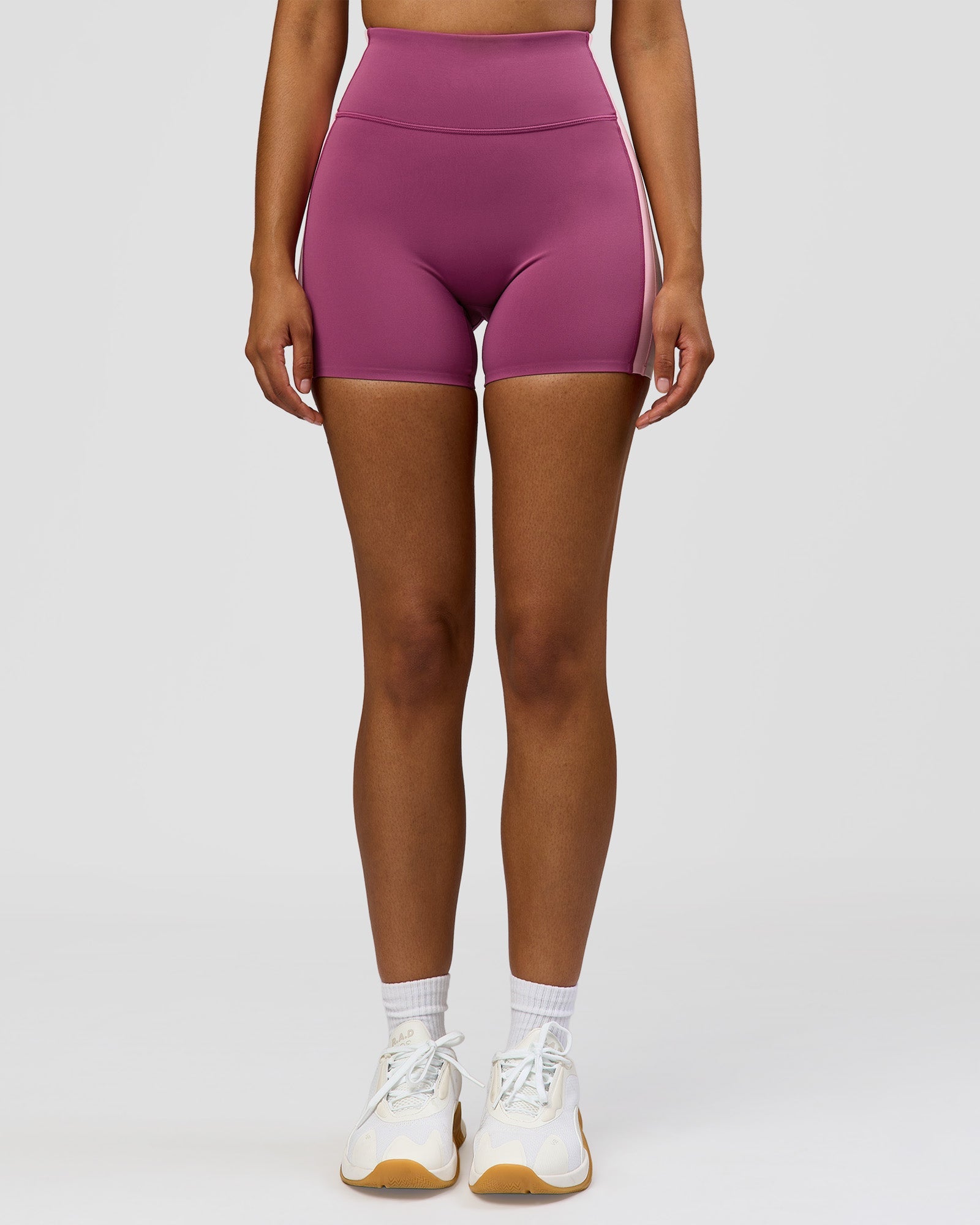 Woman wearing Revitalise Ultra High-Rise 4" Short - Boysenberry - Pink Rose | Model:Jordan | Size:S