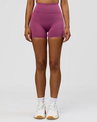 Woman wearing Revitalise Ultra High-Rise 4" Short - Boysenberry - Pink Rose | Model:Jordan | Size:S | Thumbnail Index: 1