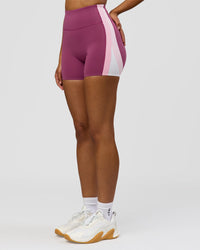 Woman wearing Revitalise Ultra High-Rise 4" Short - Boysenberry - Pink Rose | Model:Jordan | Size:S | Thumbnail Index: 3