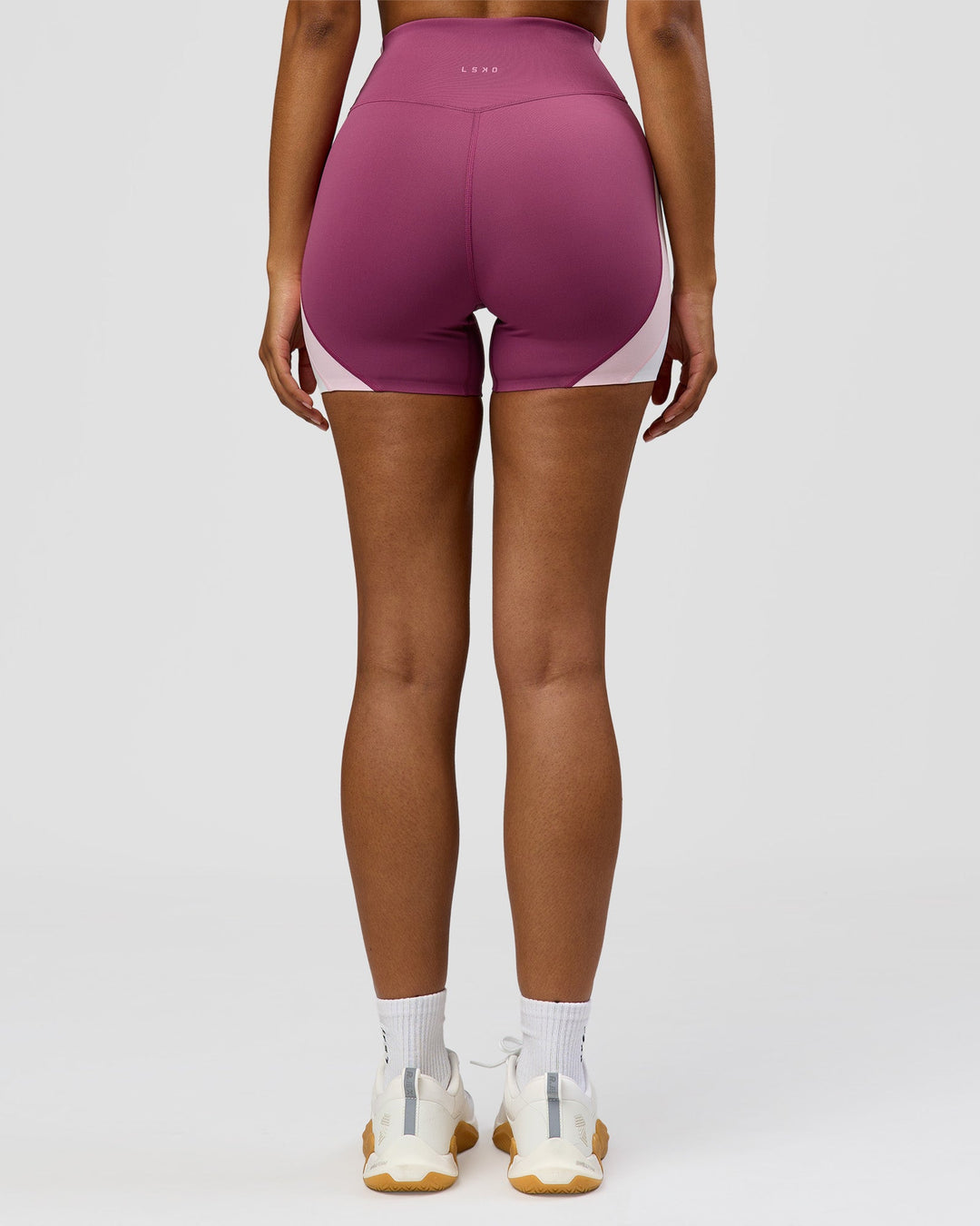 Woman wearing Revitalise Ultra High-Rise 4" Short - Boysenberry - Pink Rose | Model:Jordan | Size:S - view 11