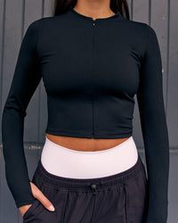 Woman wearing Sculpt Full Zip Long Sleeve Top - Black | Model:Remy | Size:S | Thumbnail Index: 1