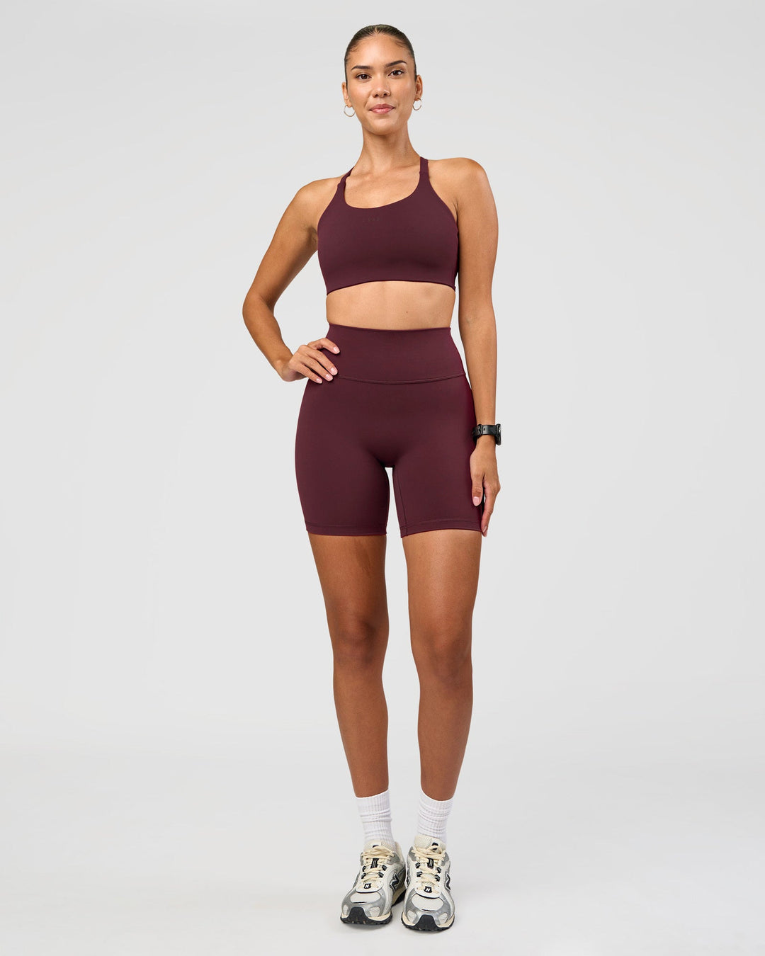 Woman wearing Twist Sports Bra D/DD/E - Cherry Lacquer | Model:Rhiley | Size:S - view 2