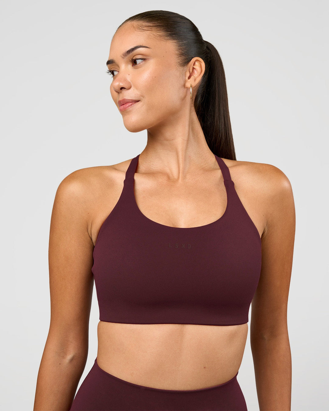 Woman wearing Twist Sports Bra D/DD/E - Cherry Lacquer | Model:Rhiley | Size:S - view 4