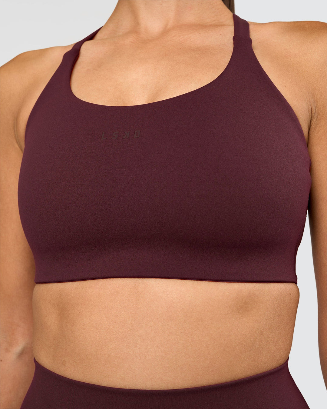 Woman wearing Twist Sports Bra D/DD/E - Cherry Lacquer | Model:Rhiley | Size:S - view 4