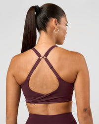 Woman wearing Twist Sports Bra D/DD/E - Cherry Lacquer | Model:Rhiley | Size:S | Thumbnail Index: 0