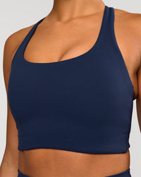 Woman wearing Flow Long Line Sports Bra - Future Navy | Model:Rosie | Size:S | Thumbnail Index: 1