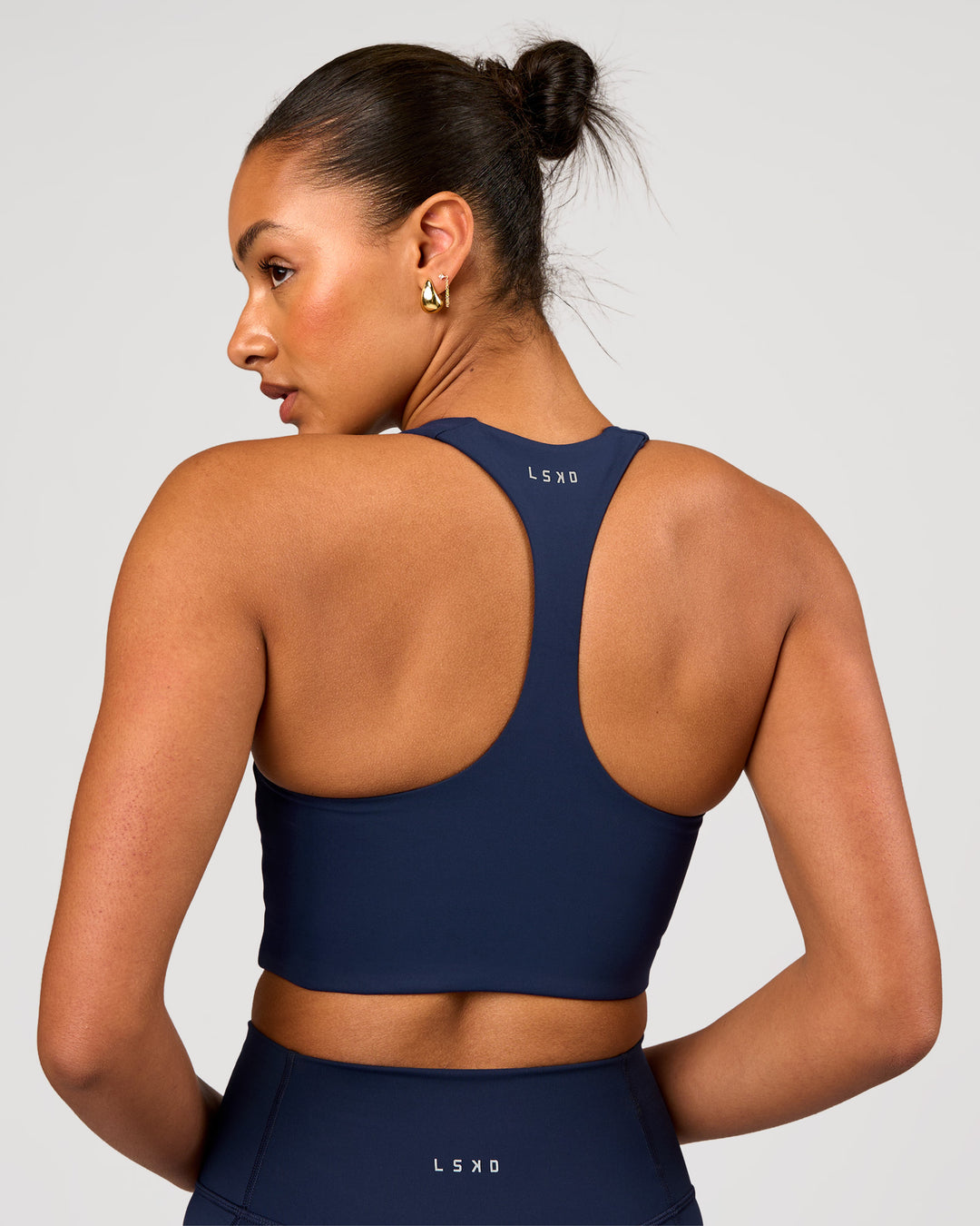 Woman wearing Flow Long Line Sports Bra - Future Navy | Model:Rosie | Size:S - view 4