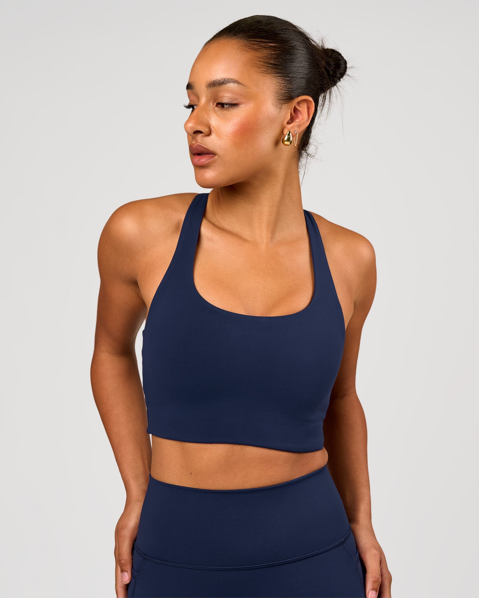 Woman wearing Flow Long Line Sports Bra - Future Navy | Model:Rosie | Size:S