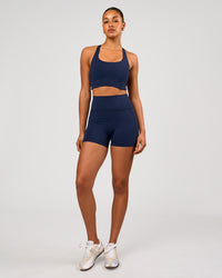Woman wearing Flow Long Line Sports Bra - Future Navy | Model:Rosie | Size:S | Thumbnail Index: 5