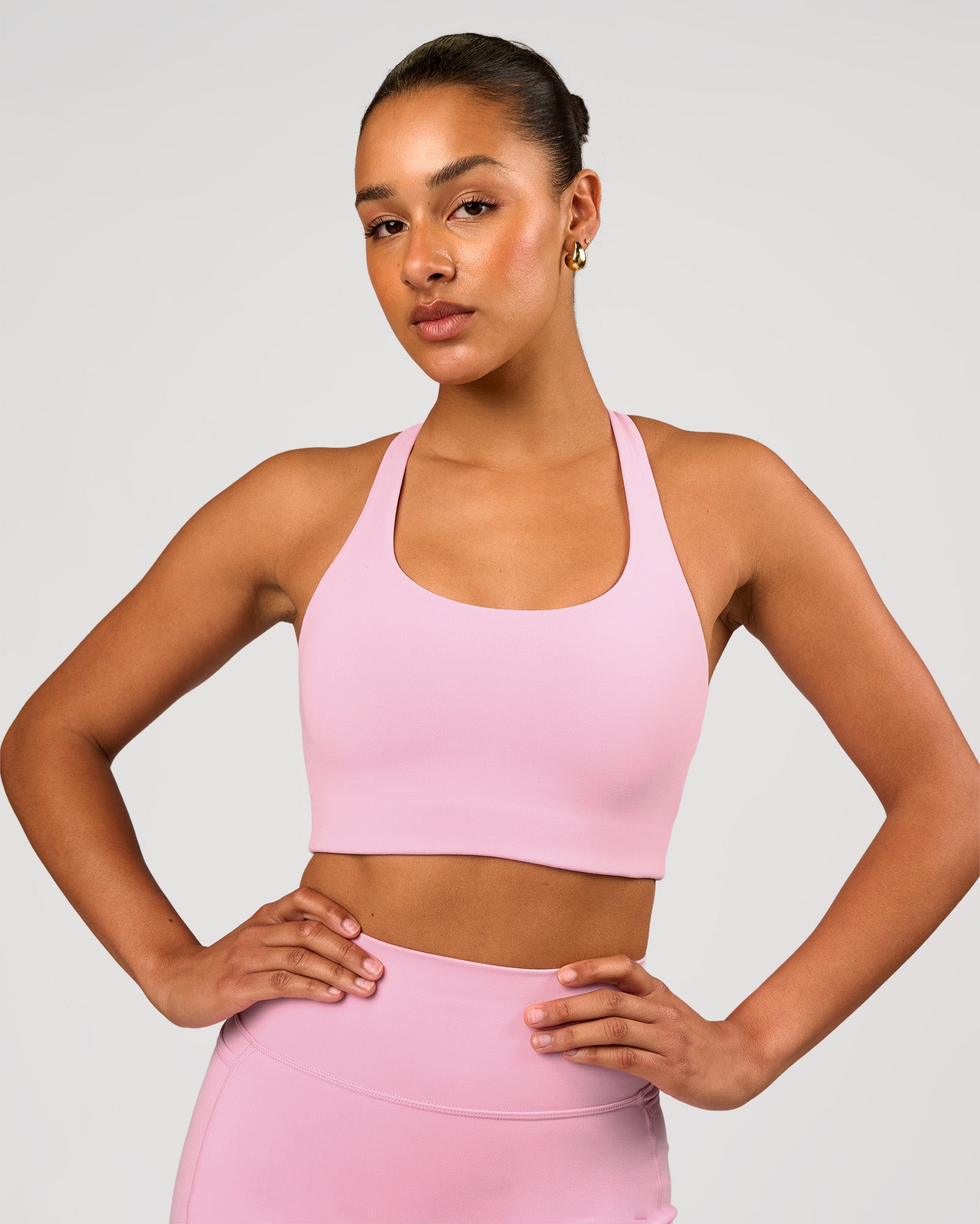 Woman wearing Flow Long Line Sports Bra - Pink Rose | Model:Rosie | Size:S
