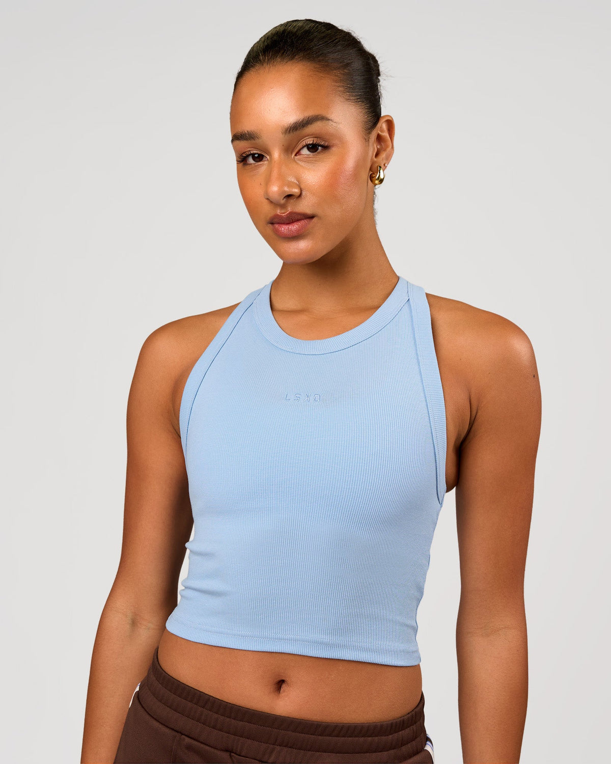 Woman wearing Go-To FLXCotton Rib Crop Tank - Open Air | Model:Rosie | Size:S - view 1