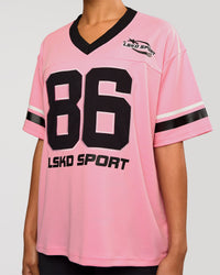 Woman wearing Playmaker V-Neck Jersey - Pink Rose-Black | Model:Rosie | Size:S | Thumbnail Index: 1