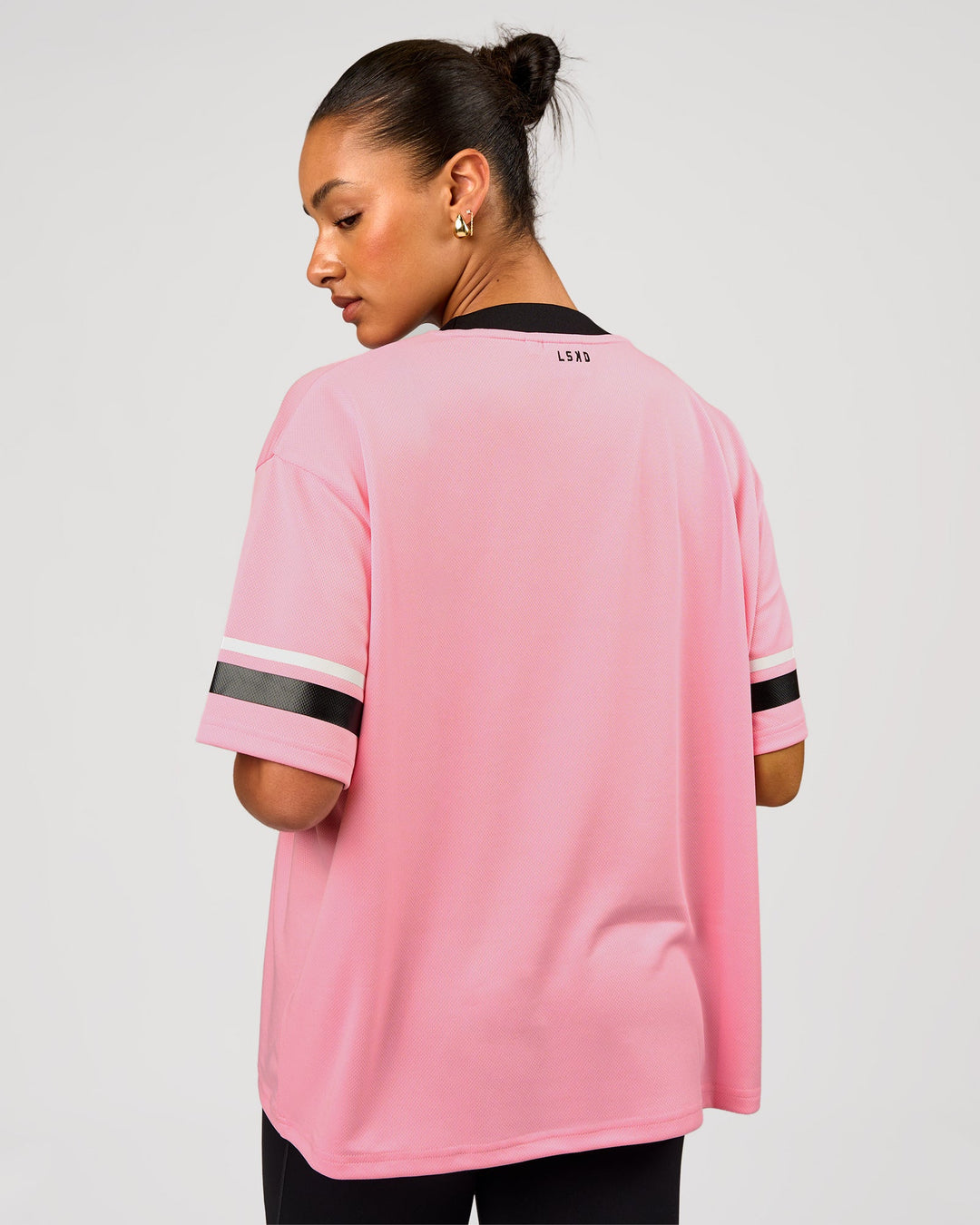 Woman wearing Playmaker V-Neck Jersey - Pink Rose-Black | Model:Rosie | Size:S - view 3