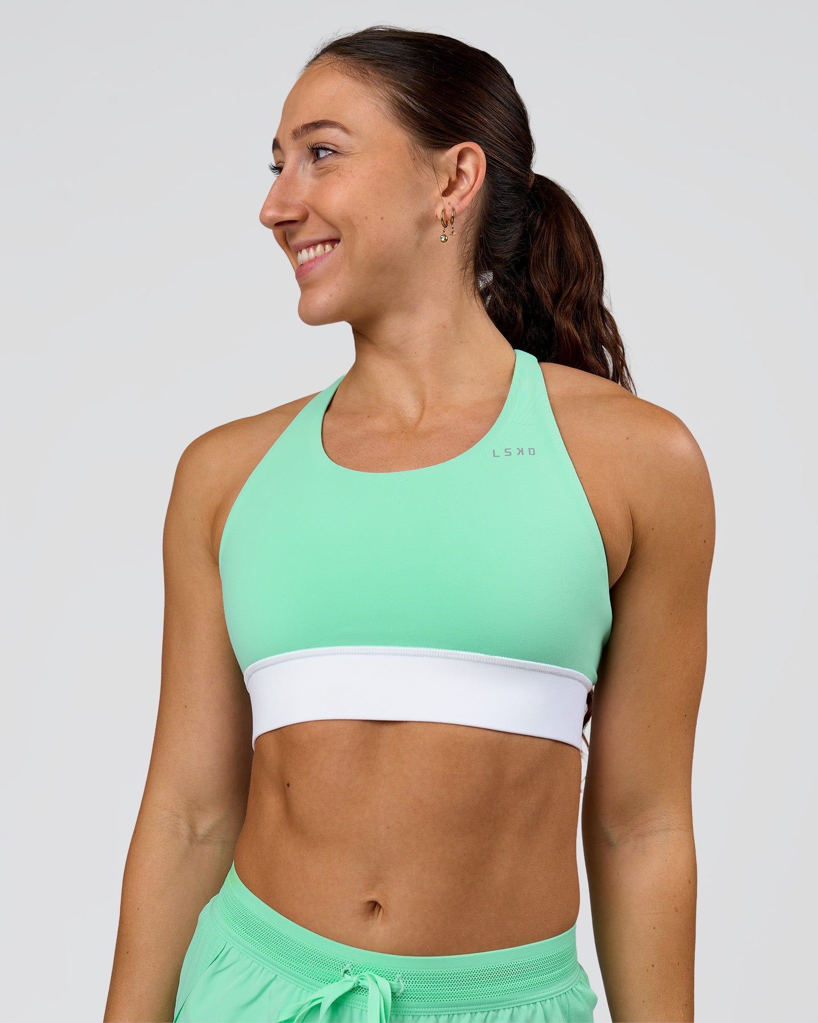 Woman wearing Accelerate Sports Bra - Jelly Mint-White | Model:Summer | Size:S