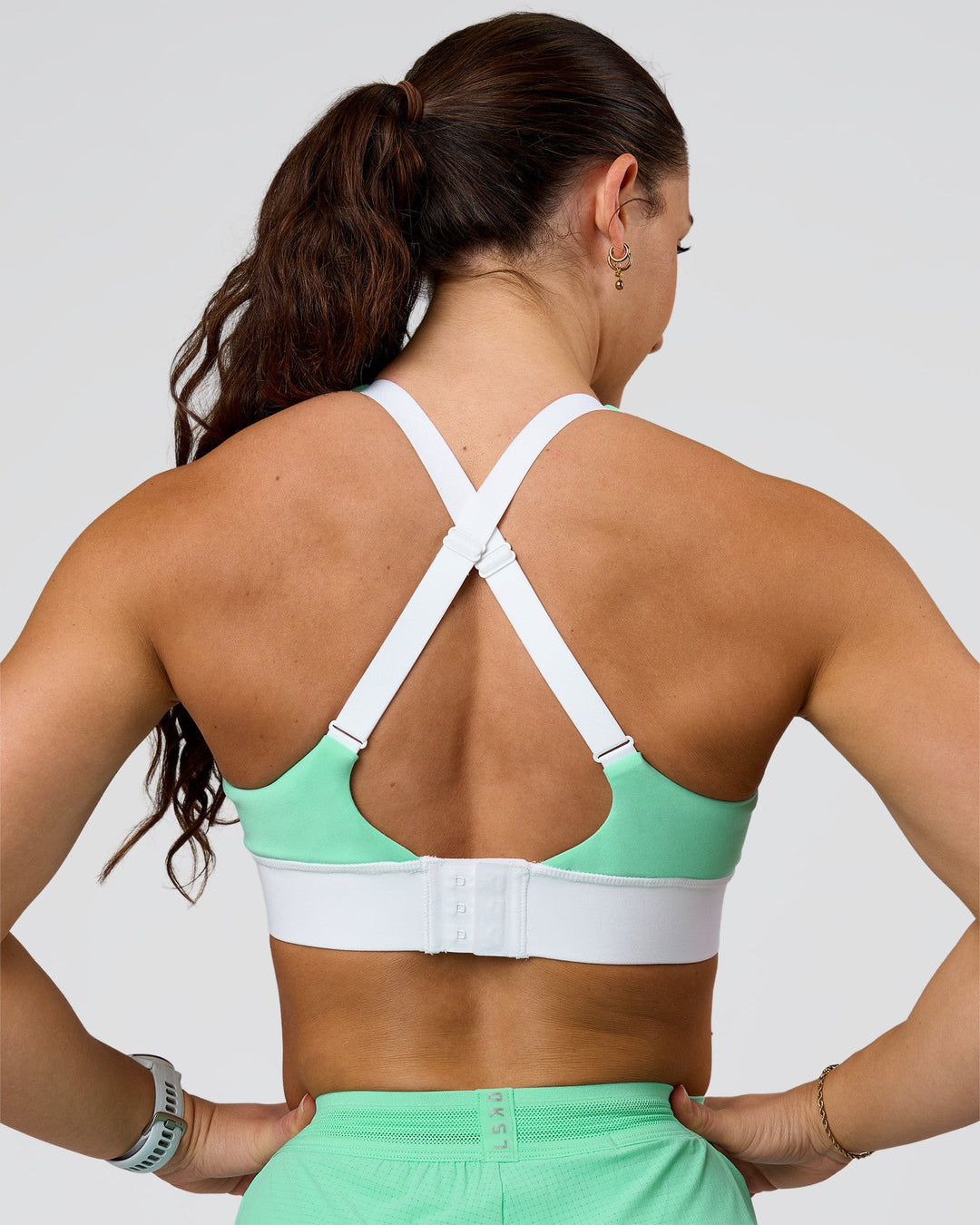 Woman wearing Accelerate Sports Bra - Jelly Mint-White | Model:Summer | Size:S - view 2