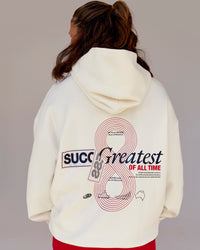 Woman wearing Greatest of All Time Heavyweight Oversized Hoodie - Off White | Model:Tia | Size:S | Thumbnail Index: 9
