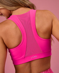 Woman wearing Empowered Sports Bra - Ultra Pink | Model:Tianah | Size:S | Thumbnail Index: 1