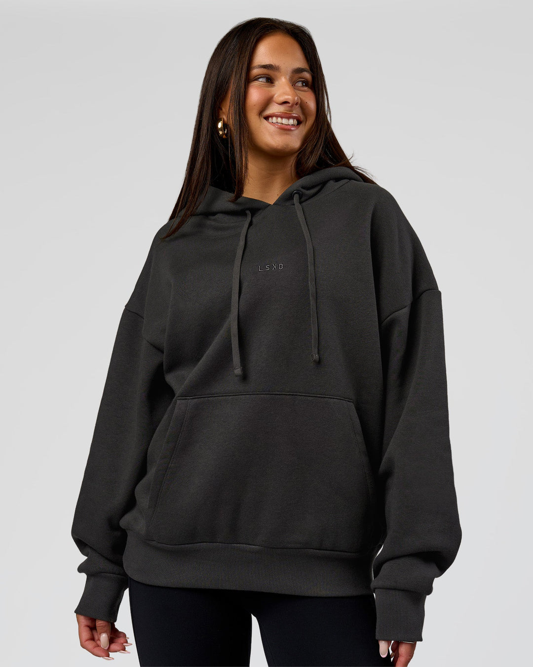 Woman wearing Base Oversized DC Hoodie - Onyx | Model:Bianca | Size:XS - view 7