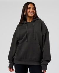 Woman wearing Base Oversized DC Hoodie - Onyx | Model:Bianca | Size:XS | Thumbnail Index: 6