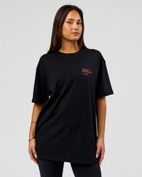 Woman wearing Coffee Run FLXCotton Oversized Tee - Black-Ultra Orange | Model:Bianca | Size:XS | Thumbnail Index: 5