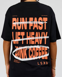 Woman wearing Coffee Run FLXCotton Oversized Tee - Black-Ultra Orange | Model:Bianca | Size:XS | Thumbnail Index: 10