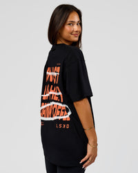 Woman wearing Coffee Run FLXCotton Oversized Tee - Black-Ultra Orange | Model:Bianca | Size:XS | Thumbnail Index: 6