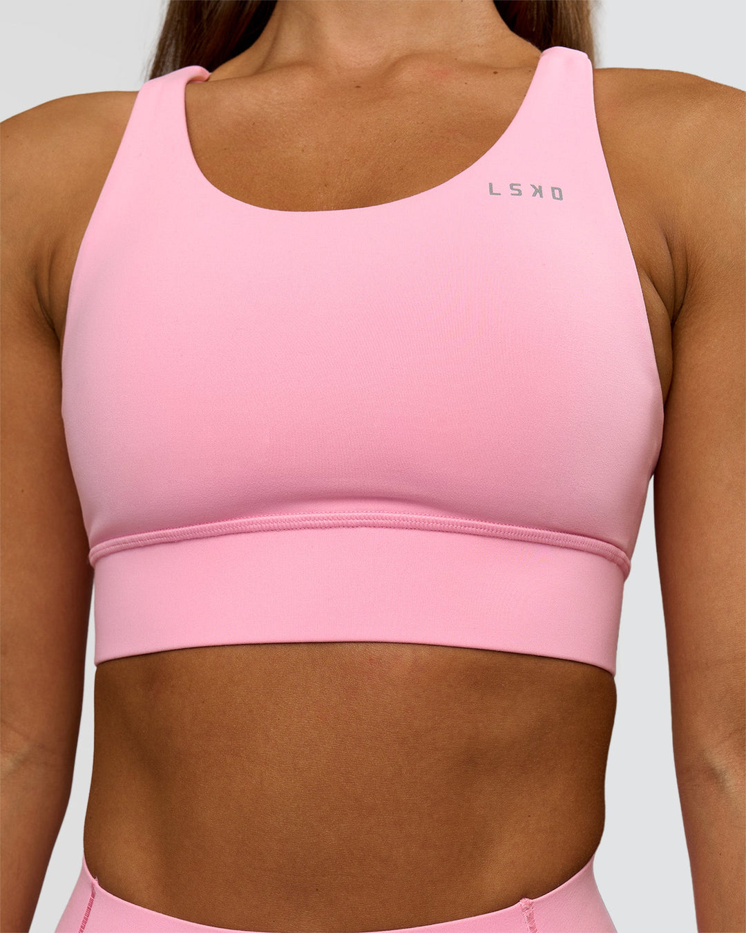 Woman wearing Accelerate Sports Bra - Pink Rose | Model:Brylee | Size:XS - view 3